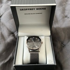 Geoffrey Beene mens wristwatch with 2 black diamonds